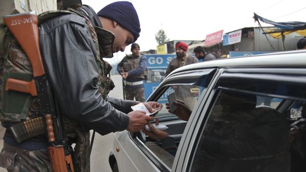 Indian security personnel check people entering an airbase in Pathankot, India, Monday, Jan. 4, 2016 - Sputnik International