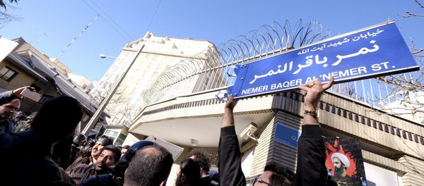 An Iranian protester holds up a street sign with the name of Shi'ite cleric Sheikh Nimr al-Nimr during a demonstration against the execution of Nimr in Saudi Arabia, outside the Saudi Arabian Embassy in Tehran January, 3, 2016 An Iranian protester holds up a street sign with the name of Shi'ite cleric Sheikh Nimr al-Nimr during a demonstration against the execution of Nimr in Saudi Arabia, outside the Saudi Arabian Embassy in Tehran January, 3, 2016 - Sputnik International