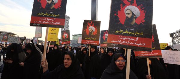 Iranian women gather during a demonstration against the execution of prominent Shiite Muslim cleric Nimr al-Nimr (portrait) by Saudi authorities, at Imam Hossein Square in the capital Tehran on January 4, 2016 Iranian women gather during a demonstration against the execution of prominent Shiite Muslim cleric Nimr al-Nimr (portrait) by Saudi authorities, at Imam Hossein Square in the capital Tehran on January 4, 2016 - Sputnik International