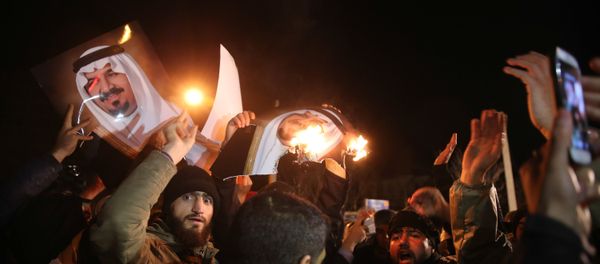 Iranian protesters gather outside the Saudi Embassy in Tehran during a demonstration against the execution of prominent Shiite Muslim cleric Nimr al-Nimr by Saudi authorities, on January 2, 2016 - Sputnik International