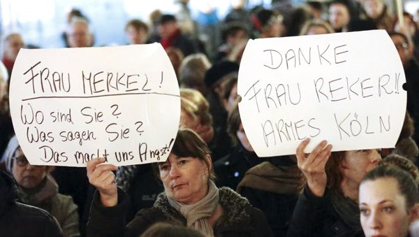 Women hold up placards that read Mrs. Merkel: Where are you? What are you saying? This worries us! and Thanks (Cologne mayor Henriette) Reker!! Poor Cologne (R) during a protest in front of the Cologne Cathedral, Germany, January 5, 2016 Women hold up placards that read Mrs. Merkel: Where are you? What are you saying? This worries us! and Thanks (Cologne mayor Henriette) Reker!! Poor Cologne (R) during a protest in front of the Cologne Cathedral, Germany, January 5, 2016 - Sputnik International