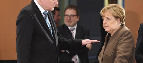 Seehofer and Merkel - Sputnik International