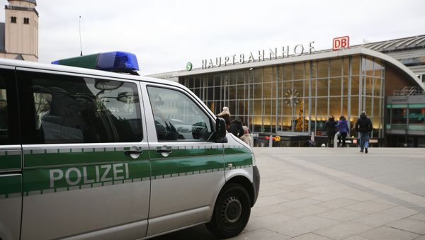 A police vehicle patrols at the main square and in front of the central railway station in Cologne, Germany, January 5, 2016. - Sputnik International