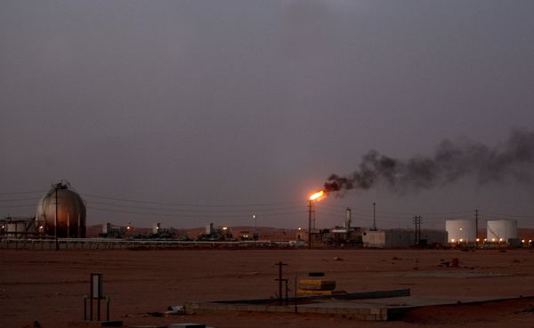 A flame from a Saudi Aramco (the national oil company) oil installation known as Pump 3 burns brightly during sunset in the Saudi Arabian desert near the oil-rich area Al-Khurais, 160 kms east of the capital Riyadh - Sputnik International
