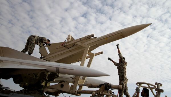 Iranian soldiers prepare to launch a Hawk surface-to-air missile during military maneuvers at an undisclosed location - Sputnik International