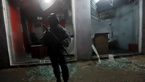 An Afghan policeman stands guard at the site of an explosion in Kabul, Afghanistan, in this January 4, 2016 file photo. An Afghan policeman stands guard at the site of an explosion in Kabul, Afghanistan, in this January 4, 2016 file photo. - Sputnik International