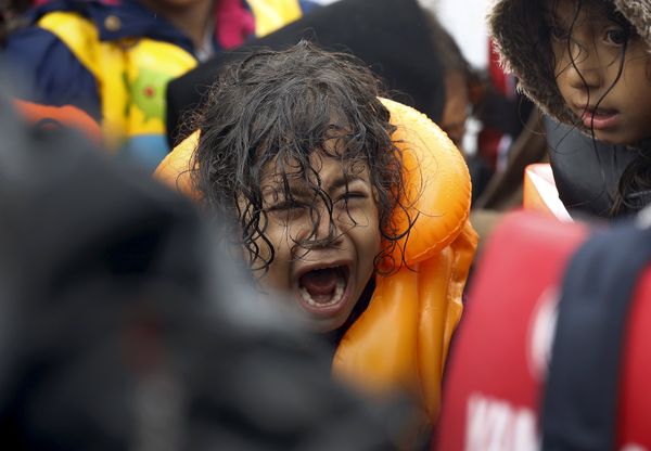 A Syrian refugee child screams inside an overcrowded dinghy after crossing part of the Aegean Sea from Turkey to the Greek island of Lesbos September 23, 2015. A Syrian refugee child screams inside an overcrowded dinghy after crossing part of the Aegean Sea from Turkey to the Greek island of Lesbos September 23, 2015. - Sputnik International