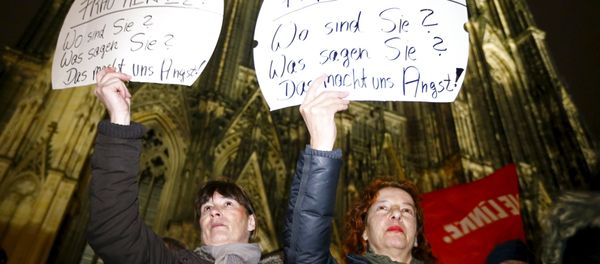 Women hold up placards that read Mrs. Merkel: Where are you? What are you saying? This worries us! during a protest in front of the Cologne Cathedral, Germany, January 5, 2016. Germans have been deeply shocked by a series of attacks, assaults, and other crimes committed by asylum-seekers taking advantage of Merkel's open-door immigration policy. Women hold up placards that read Mrs. Merkel: Where are you? What are you saying? This worries us! during a protest in front of the Cologne Cathedral, Germany, January 5, 2016. Germans have been deeply shocked by a series of attacks, assaults, and other crimes committed by asylum-seekers taking advantage of Merkel's open-door immigration policy. - Sputnik International