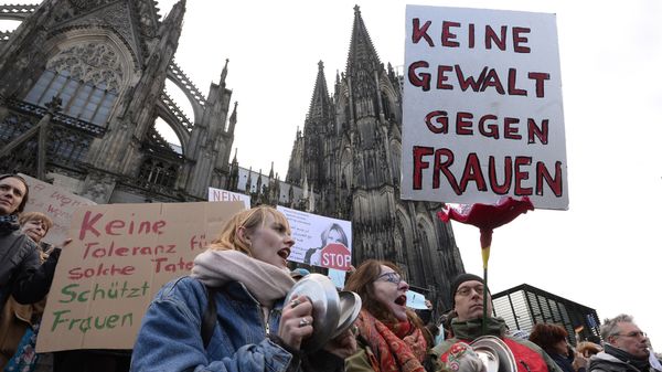 A man holds up a sign reading No violence against women as he takes part in a demonstration in front of the cathedral in Cologne, western Germany, on January 9, 2015 where sexual assaults in a crowd of migrants took place on New Year's Eve A man holds up a sign reading No violence against women as he takes part in a demonstration in front of the cathedral in Cologne, western Germany, on January 9, 2015 where sexual assaults in a crowd of migrants took place on New Year's Eve - Sputnik International