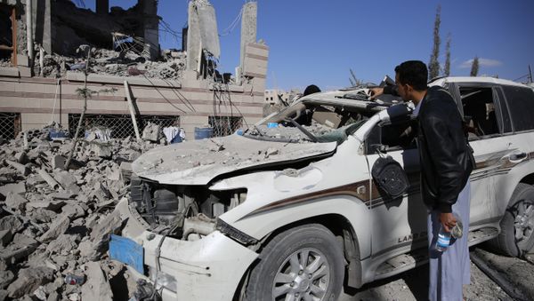 A man inspects his car damaged by Saudi-led airstrikes in Sanaa, Yemen, Friday, Jan. 8, 2016 A man inspects his car damaged by Saudi-led airstrikes in Sanaa, Yemen, Friday, Jan. 8, 2016 - Sputnik International