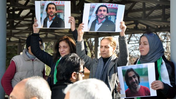Women hold pictures of film maker Naji Jerf, who was killed on December 27, during his funeral in Gaziantep on December 28, 2015 Women hold pictures of film maker Naji Jerf, who was killed on December 27, during his funeral in Gaziantep on December 28, 2015 - Sputnik International