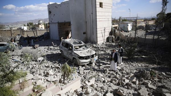 Men gather at the site of a house destroyed by Saudi-led airstrikes in Sanaa, Yemen, Friday, Jan. 8, 2016 Men gather at the site of a house destroyed by Saudi-led airstrikes in Sanaa, Yemen, Friday, Jan. 8, 2016 - Sputnik International