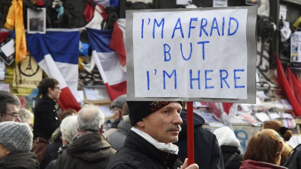 A man holding a placard reading I am afraid but I am here during a gathering on Place de la Republique (Republic square) on January 10, 2016 in Paris, as the city marks a year since 1.6 million people thronged the French capital in a show of unity after attacks on the Charlie Hebdo newspaper and a Jewish supermarket A man holding a placard reading I am afraid but I am here during a gathering on Place de la Republique (Republic square) on January 10, 2016 in Paris, as the city marks a year since 1.6 million people thronged the French capital in a show of unity after attacks on the Charlie Hebdo newspaper and a Jewish supermarket - Sputnik International