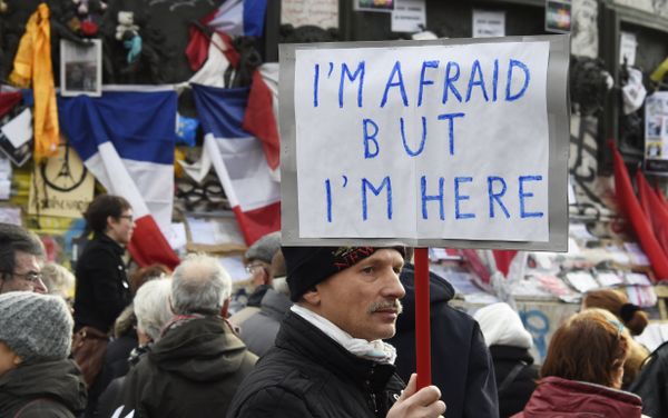 A man holding a placard reading I am afraid but I am here during a gathering on Place de la Republique (Republic square) on January 10, 2016 in Paris, as the city marks a year since 1.6 million people thronged the French capital in a show of unity after attacks on the Charlie Hebdo newspaper and a Jewish supermarket A man holding a placard reading I am afraid but I am here during a gathering on Place de la Republique (Republic square) on January 10, 2016 in Paris, as the city marks a year since 1.6 million people thronged the French capital in a show of unity after attacks on the Charlie Hebdo newspaper and a Jewish supermarket - Sputnik International