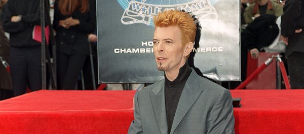 British singer David Bowie poses for photos after he received a star on the world famous Walk of Fame, 12 February 1997, in Hollywood, CA. British singer David Bowie poses for photos after he received a star on the world famous Walk of Fame, 12 February 1997, in Hollywood, CA. - Sputnik International
