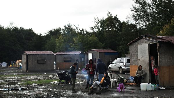 Migrants from Syria wait in the migrant camp of Grande Synthe (File) - Sputnik International