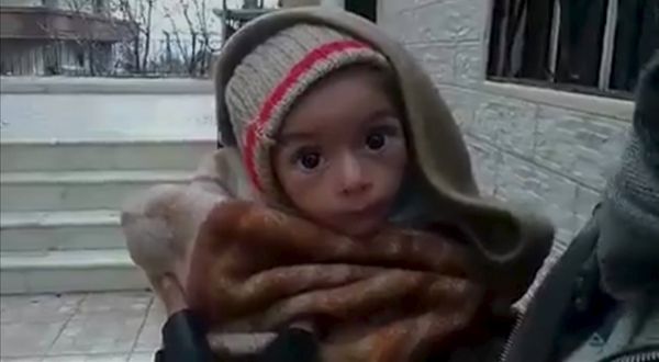 A toddler is held up to the camera in this still image taken from video said to be shot in Madaya on January 5, 2016 A toddler is held up to the camera in this still image taken from video said to be shot in Madaya on January 5, 2016 - Sputnik International