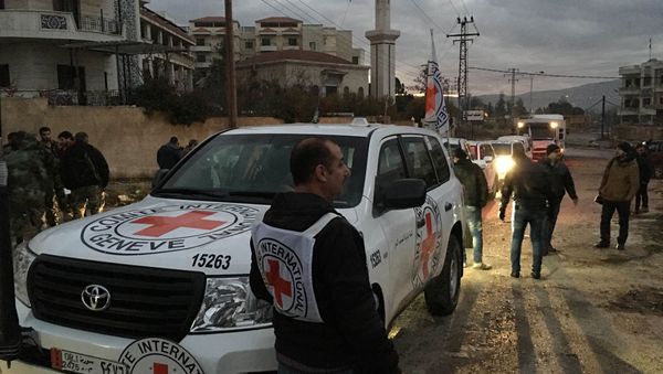 This picture provided by The International Committee of the Red Cross (ICRC), working alongside the Syrian Arab Red Crescent (SARC) and the United Nations (UN), shows a convoy containing food, medical items, blankets and other materials being delivered to the town of Madaya in Syria, Monday, Jan. 11, 2016 This picture provided by The International Committee of the Red Cross (ICRC), working alongside the Syrian Arab Red Crescent (SARC) and the United Nations (UN), shows a convoy containing food, medical items, blankets and other materials being delivered to the town of Madaya in Syria, Monday, Jan. 11, 2016 - Sputnik International