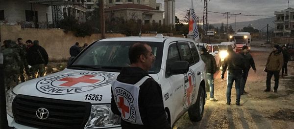 This picture provided by The International Committee of the Red Cross (ICRC), working alongside the Syrian Arab Red Crescent (SARC) and the United Nations (UN), shows a convoy containing food, medical items, blankets and other materials being delivered to the town of Madaya in Syria, Monday, Jan. 11, 2016 This picture provided by The International Committee of the Red Cross (ICRC), working alongside the Syrian Arab Red Crescent (SARC) and the United Nations (UN), shows a convoy containing food, medical items, blankets and other materials being delivered to the town of Madaya in Syria, Monday, Jan. 11, 2016 - Sputnik International