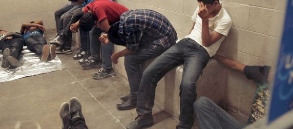 Immigrants who have been caught crossing the border illegally are housed inside the Border Patrol Station in McAllen. - Sputnik International