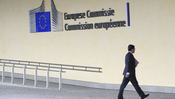 A man walks in front of the Charlemagne building at the European Union (EU) headquarters in Brussels on June 10, 2013 - Sputnik International