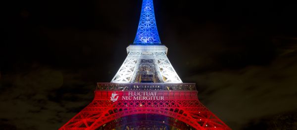 A photo taken on November 17, 2015 in Paris shows the Eiffel Tower illuminated with the colors of the French national flag in tribute to the victims of the November 13 Paris terror attacks. A photo taken on November 17, 2015 in Paris shows the Eiffel Tower illuminated with the colors of the French national flag in tribute to the victims of the November 13 Paris terror attacks. - Sputnik International
