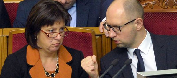 Ukrainian Prime Minister Arseniy Yatsenyuk (R) gestures as he speaks with Finance Minister Natalia Jaresko during a parliament session in Kiev. File photo. - Sputnik International