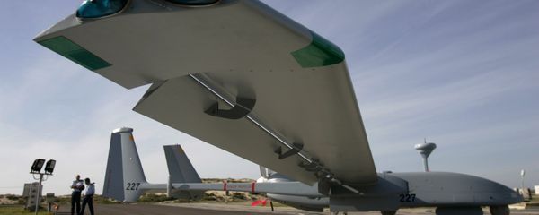 In this March 7, 2007, file photo, Israeli Air Force officers stand next to an Israeli army Heron TP drone, also known locally as the Eitan, during a display at the Palmahim Air Force Base - Sputnik International