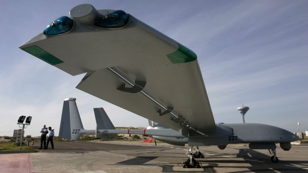  In this March 7, 2007, file photo, Israeli Air Force officers stand next to an Israeli army Heron TP drone, also known locally as the Eitan, during a display at the Palmahim Air Force Base - Sputnik International