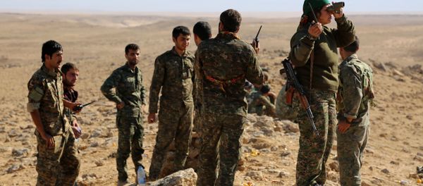 A group of coalition forces, which includes People's Protection Units (YPG) Women's Protection Units (YPJ), Sutoro militia, a pro-government Syriac Christian movement, and other forces, monitor the area in al-Hol in the Syrian Hasakeh province, some 650 kms northeast of Damascus, near the Iraqi border on November 2, 2015 A group of coalition forces, which includes People's Protection Units (YPG) Women's Protection Units (YPJ), Sutoro militia, a pro-government Syriac Christian movement, and other forces, monitor the area in al-Hol in the Syrian Hasakeh province, some 650 kms northeast of Damascus, near the Iraqi border on November 2, 2015 - Sputnik International