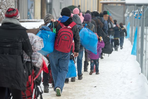 Refugees walk to a chartered train at the railway station of Passau, Germany, Jan. 5, 2016 Refugees walk to a chartered train at the railway station of Passau, Germany, Jan. 5, 2016 - Sputnik International