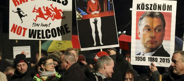 Members of LEGIDA, the Leipzig arm of the anti-Islam movement Patriotic Europeans Against the Islamisation of the West (PEGIDA), take part in a rally in Leipzig, Germany January 11, 2016. - Sputnik International