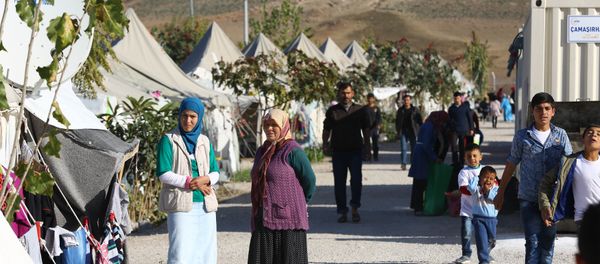 Syrian Refugees go about their daily lives at the refugee camp in Osmaniye on December 15, 2015 - Sputnik International