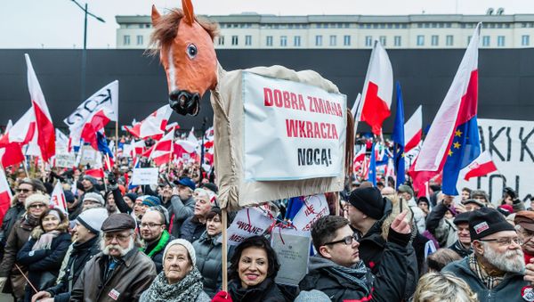 People wave European and Polish flags as they take part in a protest against a new media law in the center of Warsaw on January 9, 2016. - Sputnik International