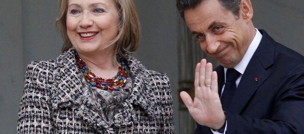 Then Secretary of State Hillary Clinton, left, is welcomed by then French President Nicolas Sarkozy before a crisis summit on Libya at the Elysee palace in Paris, Saturday, March, 19, 2011. - Sputnik International