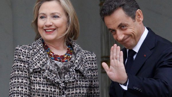 Then Secretary of State Hillary Clinton, left, is welcomed by then French President Nicolas Sarkozy before a crisis summit on Libya at the Elysee palace in Paris, Saturday, March, 19, 2011. Then Secretary of State Hillary Clinton, left, is welcomed by then French President Nicolas Sarkozy before a crisis summit on Libya at the Elysee palace in Paris, Saturday, March, 19, 2011. - Sputnik International