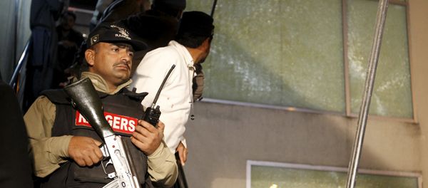 A paramilitary soldier stands guard at the ARY News offices as employees watch an attempt to remove shattered glass after a blast injured several people and caused property damage in Islamabad, Pakistan January 13, 2016. A paramilitary soldier stands guard at the ARY News offices as employees watch an attempt to remove shattered glass after a blast injured several people and caused property damage in Islamabad, Pakistan January 13, 2016. - Sputnik International