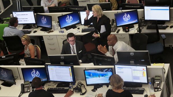 Al-Jazeera America editorial newsroom staff prepare for their first broadcast in New York. Al-Jazeera America editorial newsroom staff prepare for their first broadcast in New York. - Sputnik International