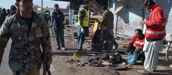 Pakistani police officers and rescue workers gather at the site of suicide bombing targeting a polio vaccination center in Quetta, Pakistan, on Wednesday, Jan. 13, 2016. - Sputnik International