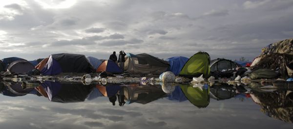 In this Tuesday, Nov. 3, 2015, file photo, tents and waste are reflected in a puddle inside the migrants camp near Calais, northern France - Sputnik International