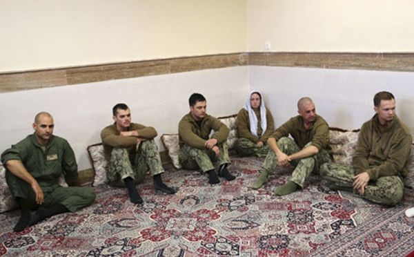 This picture released by the Iranian Revolutionary Guards on Wednesday, Jan. 13, 2016, shows detained American Navy sailors in an undisclosed location in Iran. Less than a day after 10 U.S. Navy sailors were detained in Iran when their boats drifted into Iranian waters, they and their vessels were back safely Wednesday with the American fleet - Sputnik International