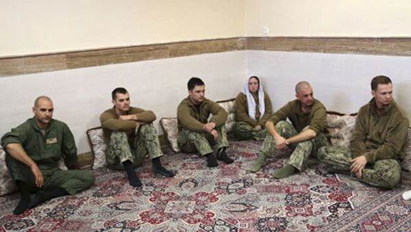 This picture released by the Iranian Revolutionary Guards on Wednesday, Jan. 13, 2016, shows detained American Navy sailors in an undisclosed location in Iran. Less than a day after 10 U.S. Navy sailors were detained in Iran when their boats drifted into Iranian waters, they and their vessels were back safely Wednesday with the American fleet - Sputnik International