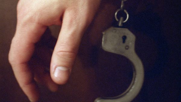 Handcuffs on a hand - Sputnik International