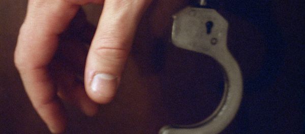 Handcuffs on a hand - Sputnik International