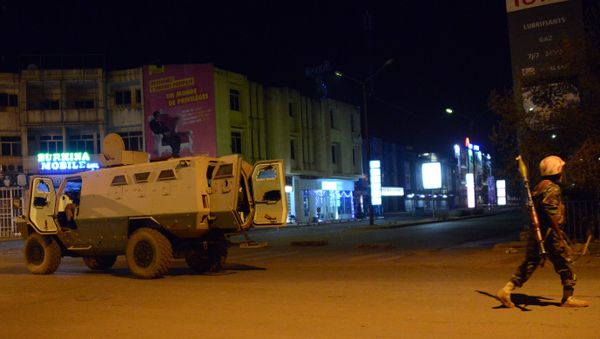 Army forces drive near Hotel Splendid where the attackers remain with sporadic gunfire continuing in Burkina Faso's capital Ouagadougou on January 15, 2016. - Sputnik International