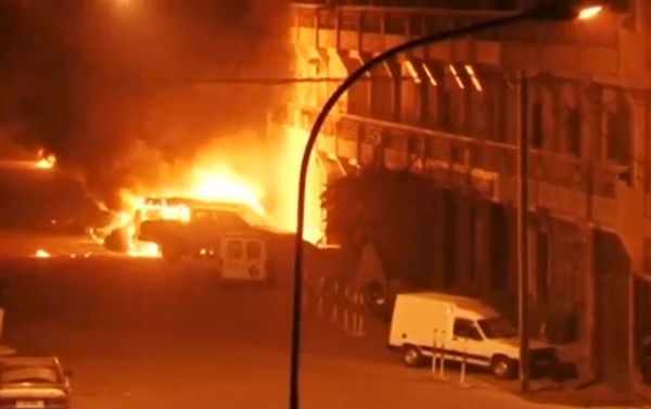 View shows vehicles on fire outside Splendid Hotel in Ouagadougou View shows vehicles on fire outside Splendid Hotel in Ouagadougou - Sputnik International