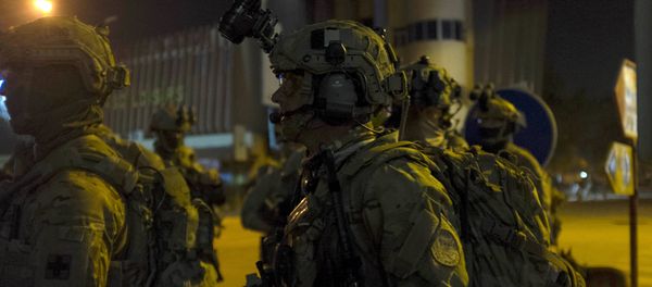 French and U.S. soldiers gather before launching a counter-assault on Islamist gunmen at the Splendid Hotel in Ouagadougou, Burkina Faso, January 16, 2016 French and U.S. soldiers gather before launching a counter-assault on Islamist gunmen at the Splendid Hotel in Ouagadougou, Burkina Faso, January 16, 2016 - Sputnik International