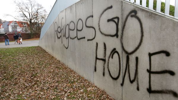The lettering Refugees GO HOME is sprayed onto a wall in Sigmaringen, southern Germany The lettering Refugees GO HOME is sprayed onto a wall in Sigmaringen, southern Germany - Sputnik International