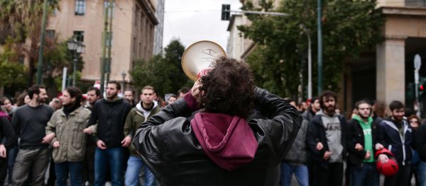 A demonstrator shouts slogans in a megaphone during a rally in central Athens on January 16, 2016 called by Greek main workers' unions to condemn a planned overhaul of Greece's pension system demanded by its international creditors. A demonstrator shouts slogans in a megaphone during a rally in central Athens on January 16, 2016 called by Greek main workers' unions to condemn a planned overhaul of Greece's pension system demanded by its international creditors. - Sputnik International
