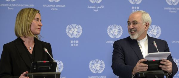 Iranian Foreign Minister Mohammad Javad Zarif (R) and EU foreign policy chief Federica Mogherini hold a press conference in Vienna on January 16, 2016. Iranian Foreign Minister Mohammad Javad Zarif (R) and EU foreign policy chief Federica Mogherini hold a press conference in Vienna on January 16, 2016. - Sputnik International